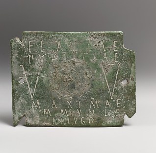 Bronze Plaque of the Vestal Virgin Flavia Publicia from the Metropolitan Museum of Art (Photo Via the Met. View it Here). 