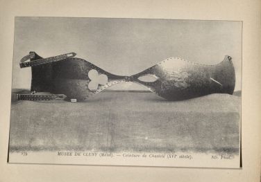 A chastity belt displayed in the Musée de Cluny in Paris. The postcards are now in the Harvard Archives. 